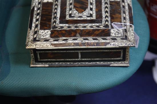 An 18th century Indo-Portuguese ivory, ebony and tortoiseshell games box, width 15.25in.